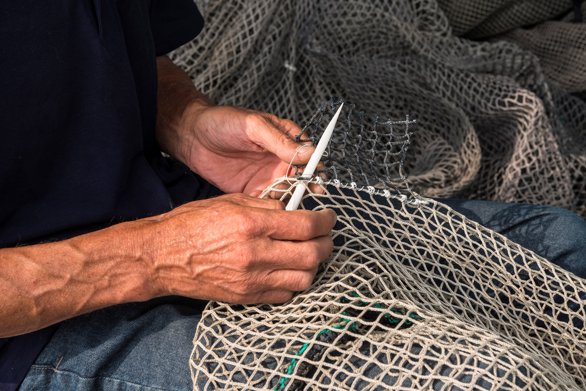 mending nets by hand